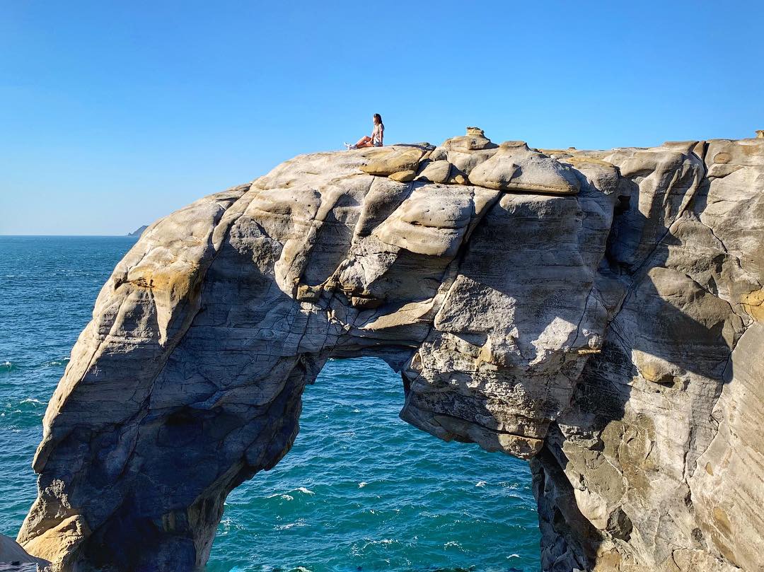 Sitting on top of Elephant Trunk cliff in Taipei Coast