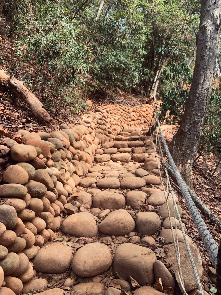Stony steps greet you in the beginning of the hike. Red stony steps leading up the hike.